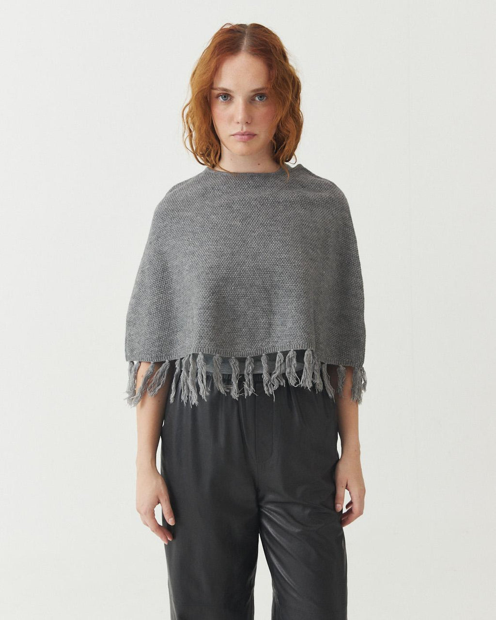 PONCHO TEJIDO FLECOS