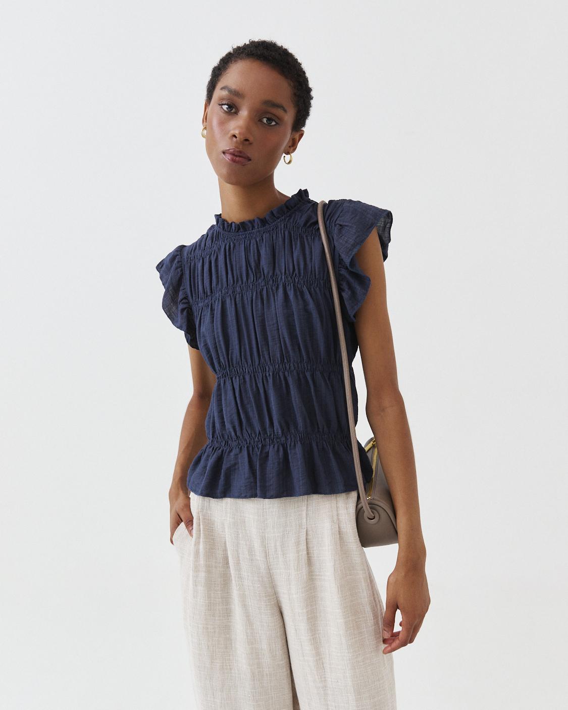 RUFFLED SLEEVELESS TOP