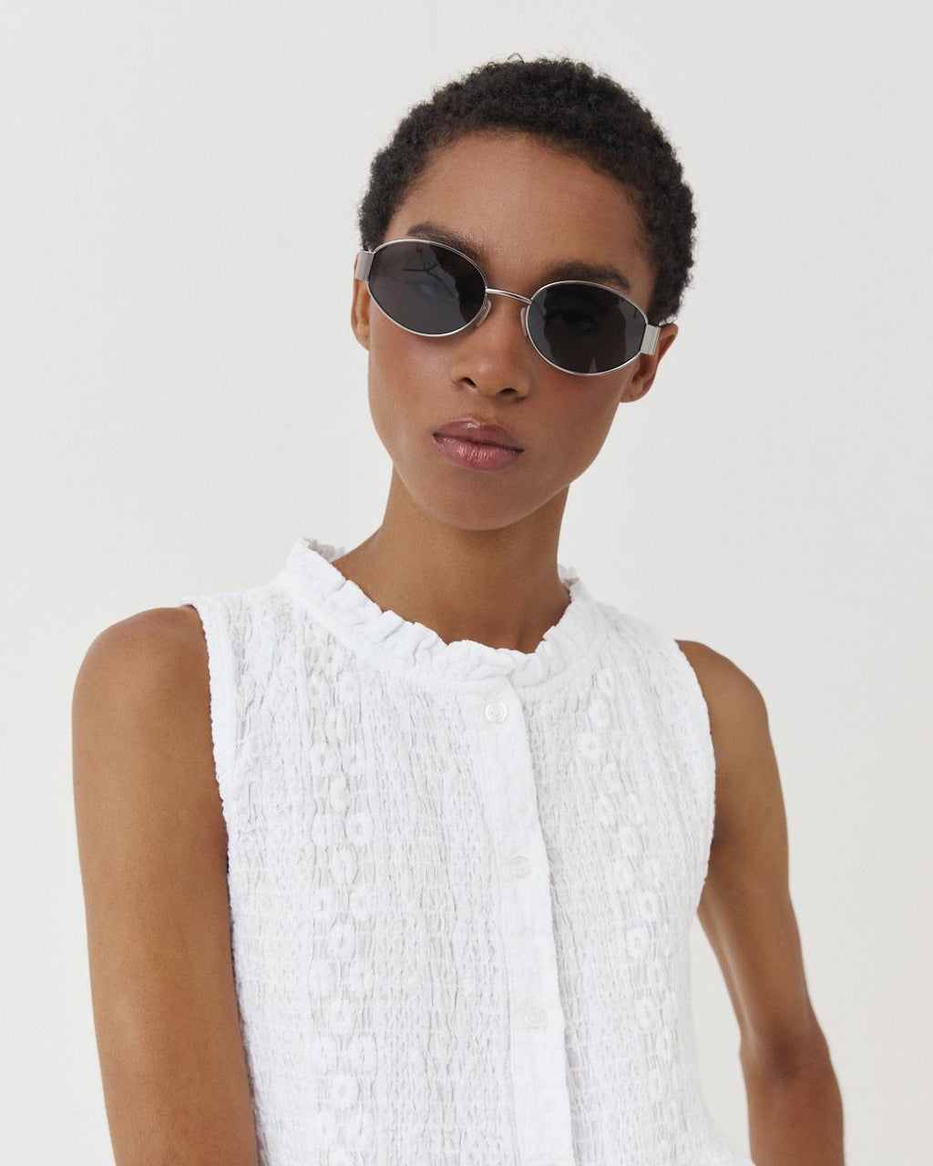 EMBROIDERED SMOCKED PEPLUM TOP