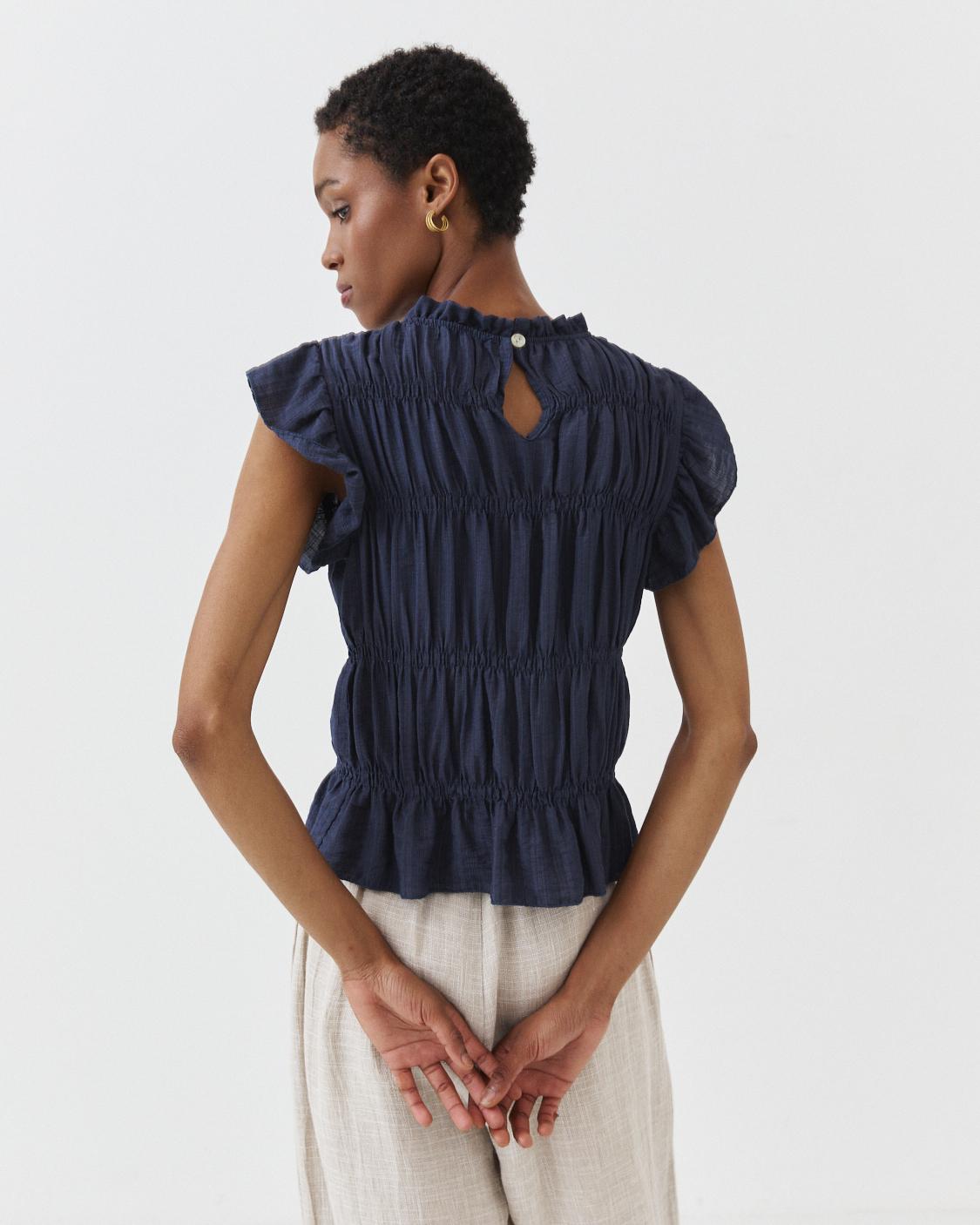 RUFFLED SLEEVELESS TOP